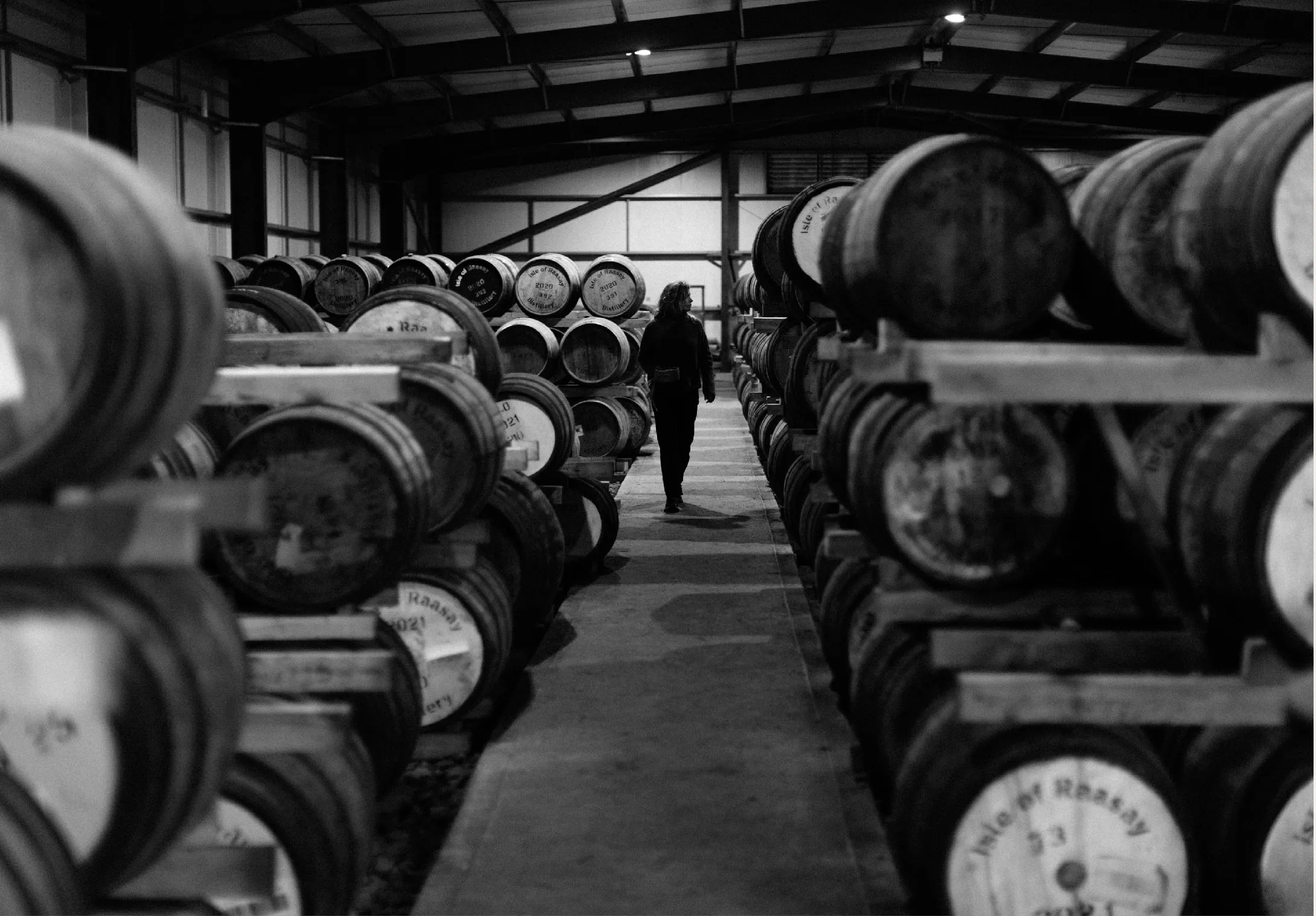 Rows of whisky casks maturing in the Isle of Raasay warehouse